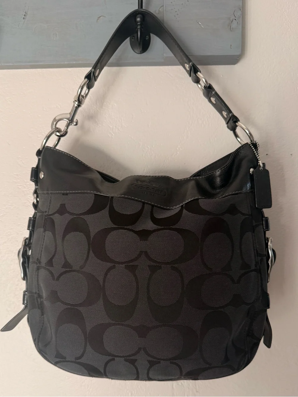 Coach Signature Logo Large Shoulder Bag in Black with large silver buckle detai
